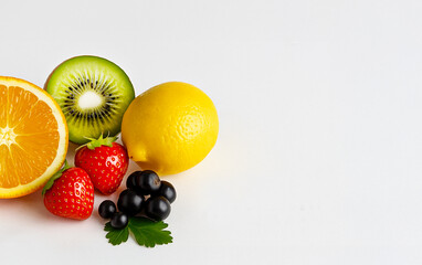 Fresh fruits rich in vitamin C — orange, lemon, kiwi, strawberry, and blackcurrant on a white background. Healthy eating and natural source of antioxidants.
