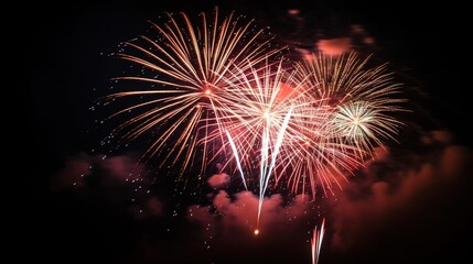 Obraz premium dazzling array of fireworks bursts into night sky, illuminating darkness with bright colors and patterns. celebration creates atmosphere of joy and excitement for everyone present