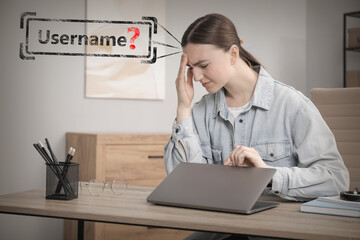 Troubled woman with laptop trying to remember password and username at table