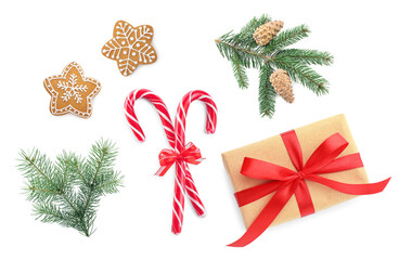 Christmas candy canes, gingerbread cookies, gift box and fir tree branches isolated on white, set