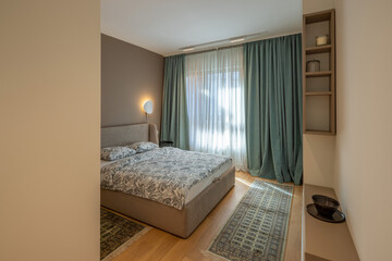 Interior of a bedroom with large master bed