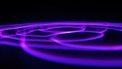 Abstract purple light trails in dark background, long exposure photography