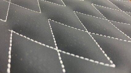 Beautiful thread stitching on the black leather.