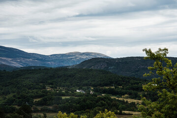 landscape with hills under a dark clouded sky in the French region of the Verdon