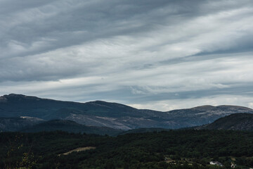 landscape with hills under a dark clouded sky in the French region of the Verdon