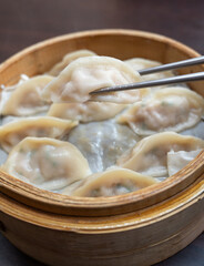 Steamed dumplings in bamboo steamer.