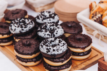 Set of coffee break in the hotel during conference meeting, with tea and coffee catering, decorated catering banquet table with variety of different pastry and bakery, with croissants, pie and cookies