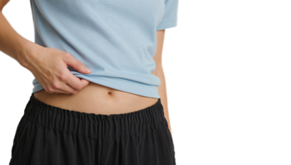 A person in casual clothing shows their stomach and navel area, highlighting a smooth skin tone and flat abdomen