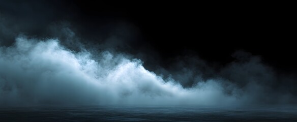 Obraz premium Rolling slate mist cloud against a dark backdrop creates a moody atmosphere.