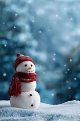 Fototapeta premium Cheerful snowman in red scarf and hat adorning a snowy winter wonderland