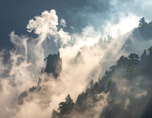 Misty mountain scene with sun rays peeking through trees and fog