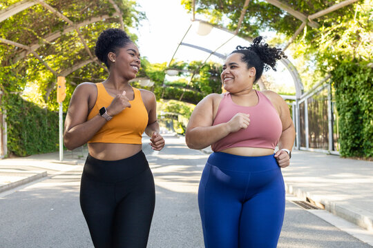 Two women enjoying a friendly jog outdoors