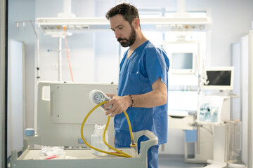 Nursing assistant working in ICU setting