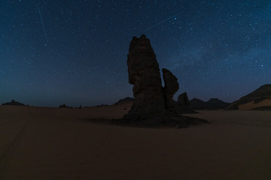 Starry night view of rock formations in the Akakus desert