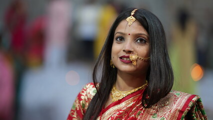 Newly married Indian woman smiling in red saree, symbolizing joy, beauty, and the traditional grace of Indian culture.