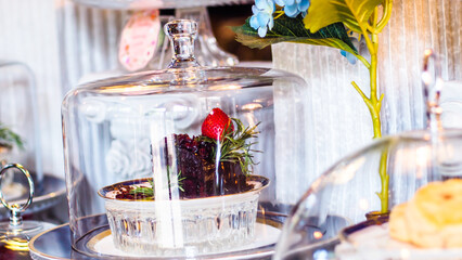 Elegant Dessert Under a Glass Cloche for Afternoon Tea