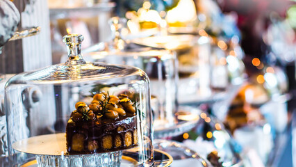 Chocolate Cake Under Glass Dome Displayed,
