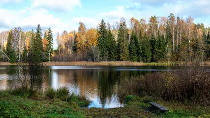 autumn landscape, lake shore, day by the lake, colorful trees reflecting in the lake water, Vaidava...