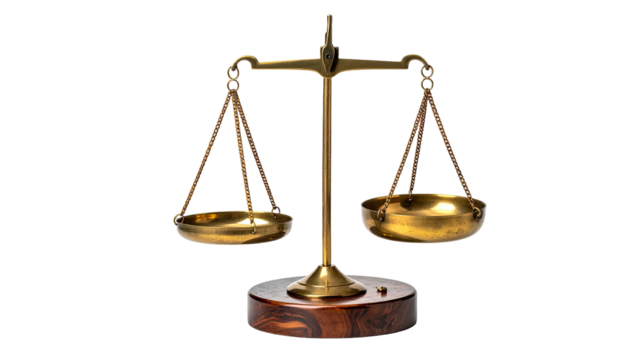 Gold scales balance on wooden base, against a black backdrop