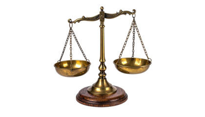 Brass scales of justice slightly off-balance, on wooden base