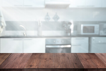 Capture your culinary creativity with a rustic wooden table foregrounding a bright, modern kitchen setting perfect for food styling and recipe content.