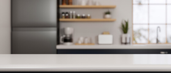 Modern kitchen counter with blurred background showing appliances, shelves, and a window, perfect...