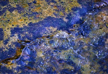 Abstract background with clear colorful water and transparent surface with blue nature pattern