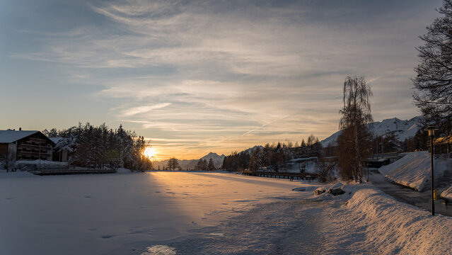 Sunset over snowy alps during wintertime magic