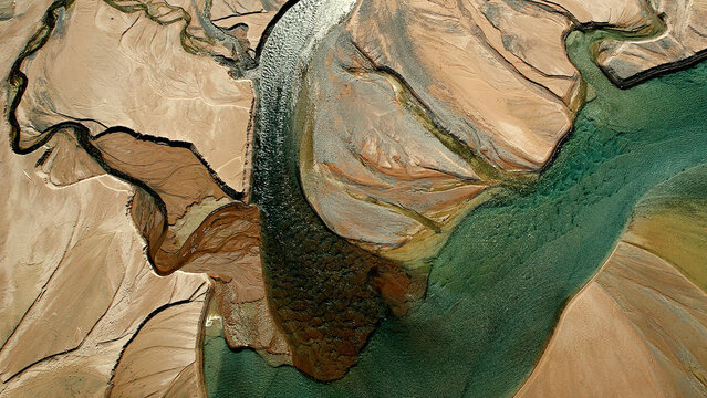 Drone view of river delta with turquoise water and sand textures at Issyk Lake Almaty Kazakhstan