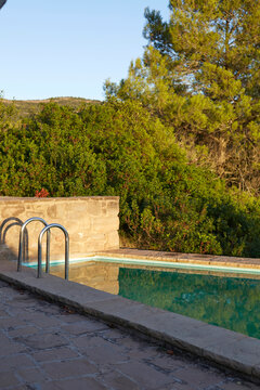 Tranquil Rural Poolside Reflecting Nature's Calm