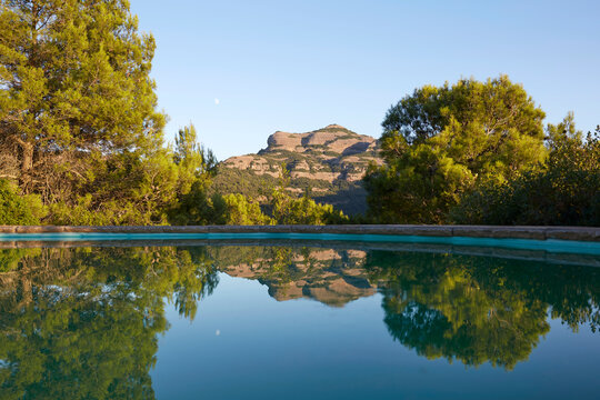 Tranquil mountain reflection in serene rural landscape