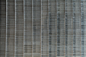 Background and texture of iron nails for a pneumatic nail gun, closeup, top view. Abstract surface of carpenters nails