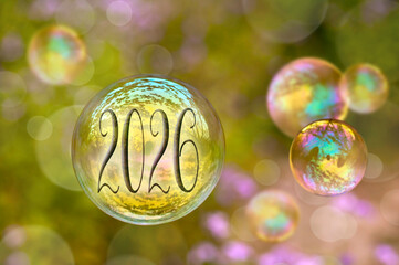 2026 numbers, floating soap bubble on green nature background greeting card