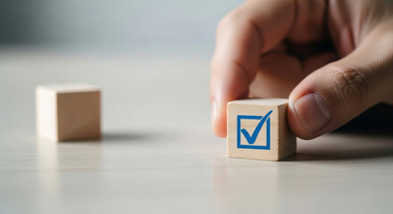 Hand placing wooden block with check mark symbol on surface