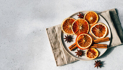 Overhead Dried Orange Slices Cinnamon Star Anise Light Gray Countertop