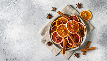Overhead Dried Orange Slices Cinnamon Star Anise Light Gray Background