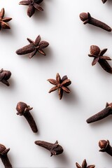 Arrangement Of Cloves And Star Anise Spices On White Background