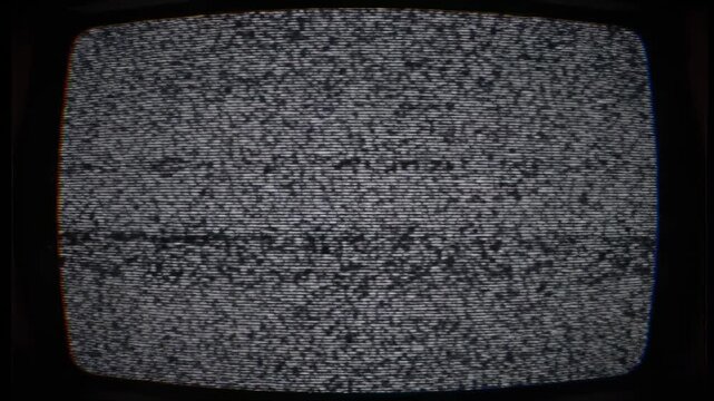 A grainy television screen displaying static with a dark border