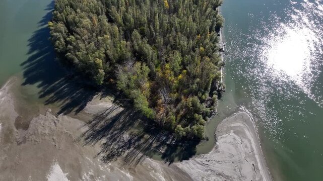 Aerial down video of a luch river island on the Danube.