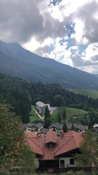 View of Val Serina from Zambla Alta Village, Italian Alps, During a Cloudy Summer Day