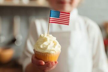 Celebrating American pride with a chef holding a cupcake decorated with a USA flag in a cozy kitchen setting