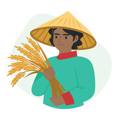 Darkhaired farmer with a conical hat holds wheat bunches against a simple pale green background