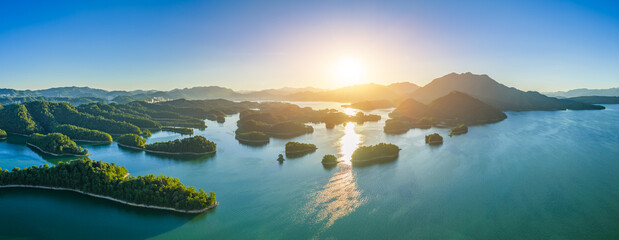 Aerial view of the beautiful lake and green mountain natural landscape at sunrise. Famous Qiandao...