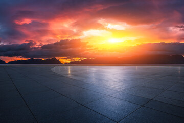 Empty square floor and mountain with beautiful sky clouds at sunset