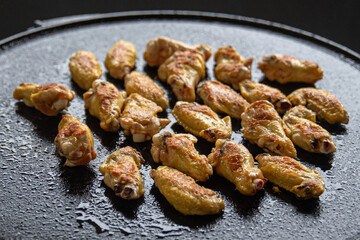 Grilled chicken wings over the fire
