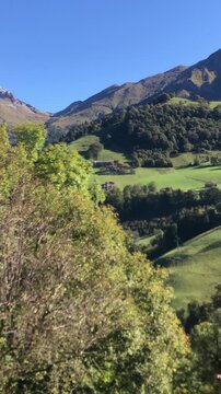 View of the Snowy Peak of Mount Arera from Zambla Bassa Mountain Village during a Sunny Late Summer Day. Bergamo Province, Italian Alps