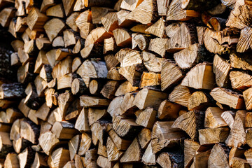Neatly stacked firewood pieces outdoors