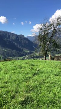 Panoramic View on Val Brembana Valley from Dossena Mountain Village, in the Italian Alps, during a Sunny Summer Day. Bergamo Province, Italy