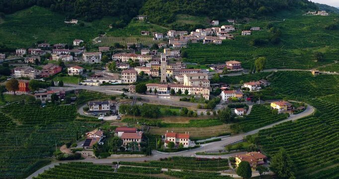 A View Of Santo Stefano Village At Valdobbiadene Town And Prosecco Vineyards In Veneto, Treviso, Italy. Aerial Shot