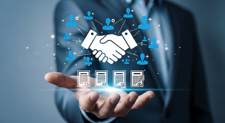 Businessman holding virtual handshake and document icons for partnership deal
